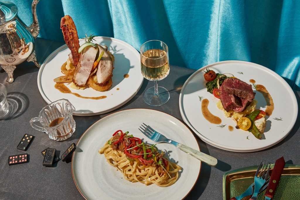 Grilled pork, beef with mash and pasta plated at TUBA Bangkok